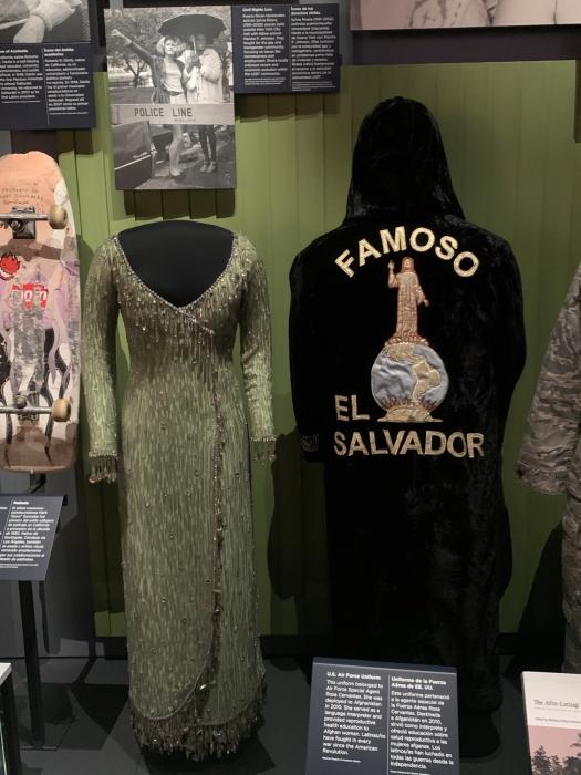 Black velvet robe with words "Famoso El Salvador" and image of Monument to the Divine Savior of the World.