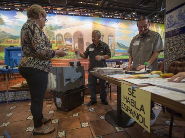 Color photo of a polling station inside a Mexican restaurant in Los Angeles.