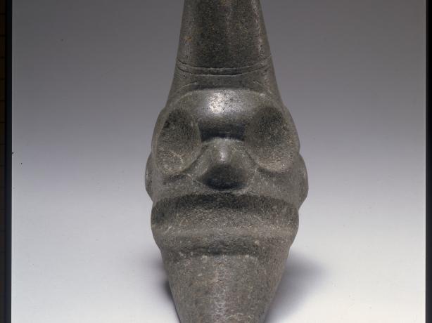 Gray Taino sculpture of a face   