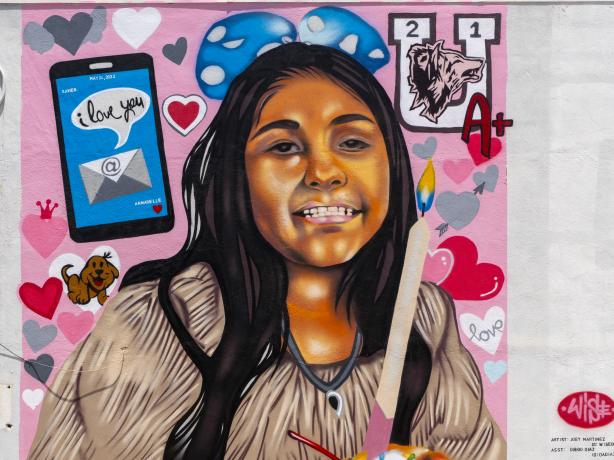 Close-up color photo of portrait mural of Annabell Rodriguez.
