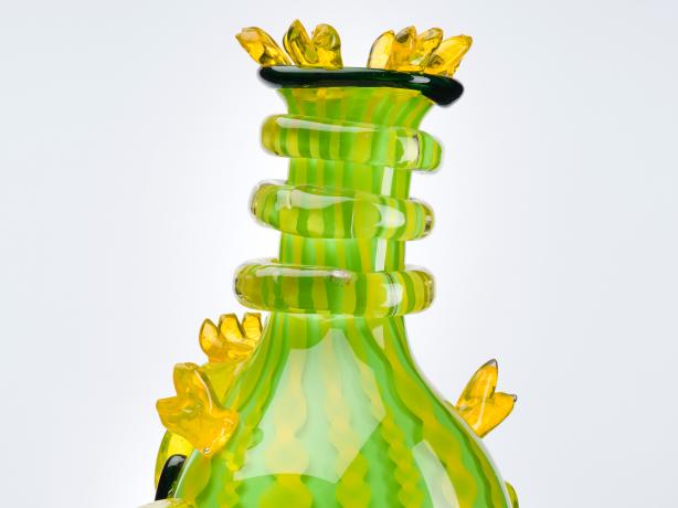 Detail of de la Torre Brothers piece "Chacamotas" showing details of green and yellow glasswork