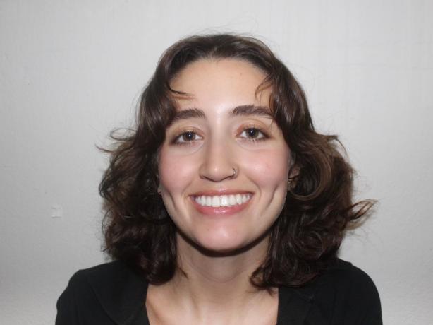 Headshot of a woman wearing a black blouse.