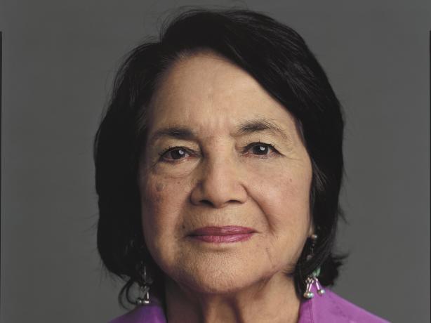 Portrait of Dolores Huerta in a pink shirt