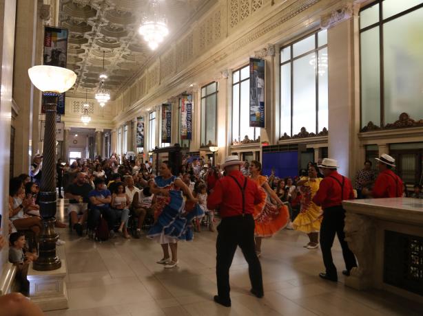 Group of dancers performing at a museum family day. 