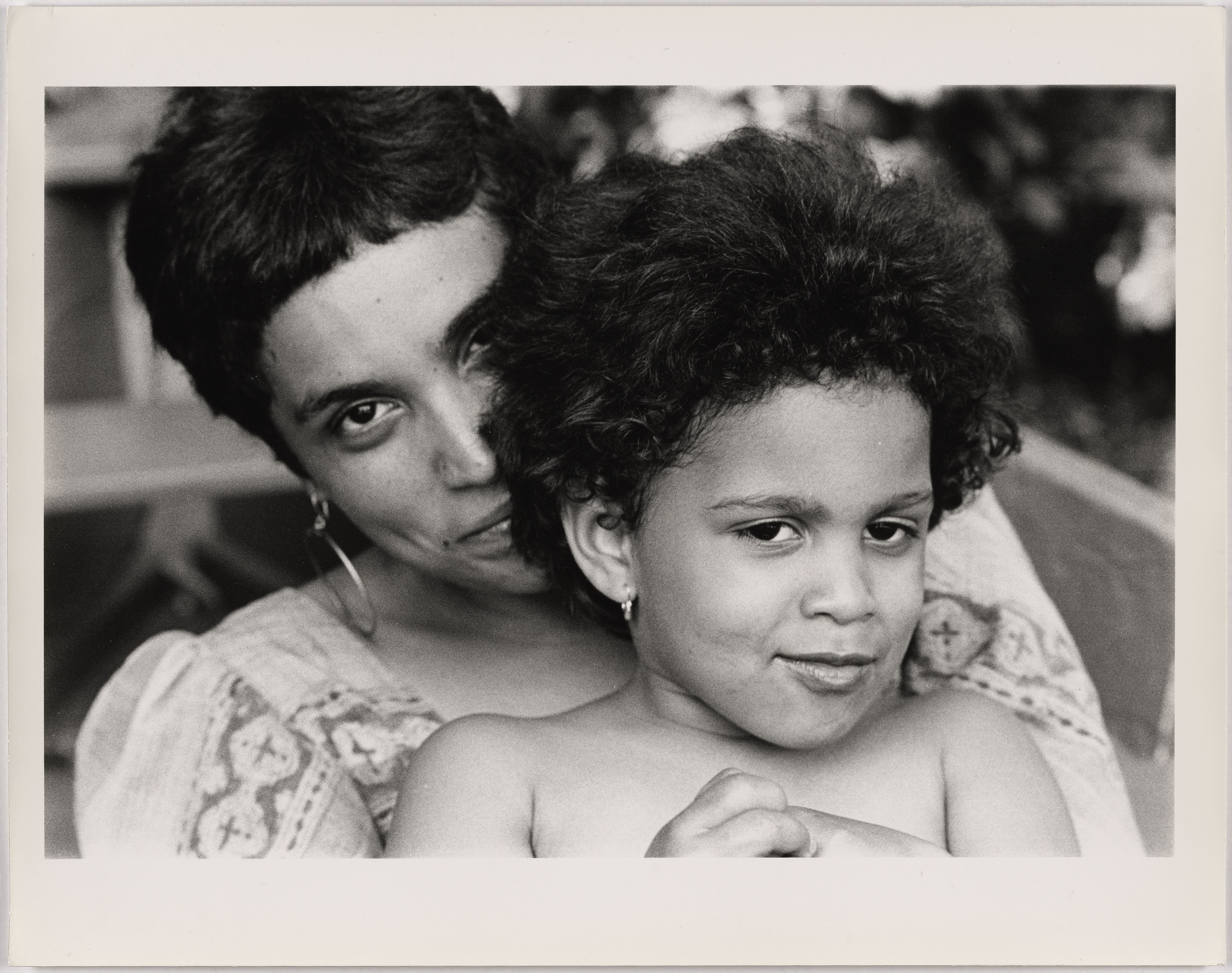 00127-D2-2021.07.30 black and white photograph of a mother with her child on her lap