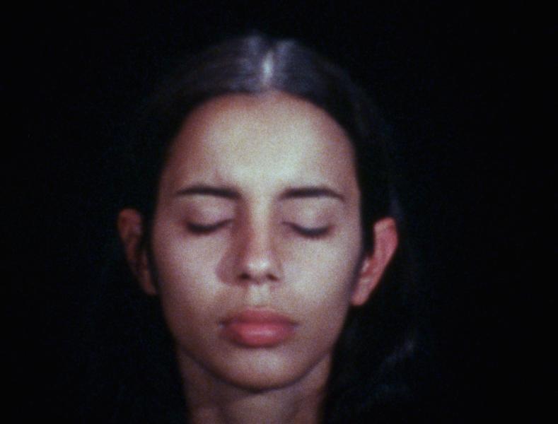 Ana Mendieta Still image of the face of Ana Mendieta. He eyes are closed.