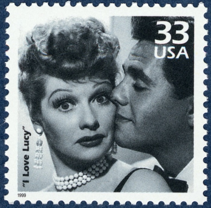 Desi Arnaz Postal stamp featuring actor Desi Arnaz giving Lucy a kiss on the cheek
