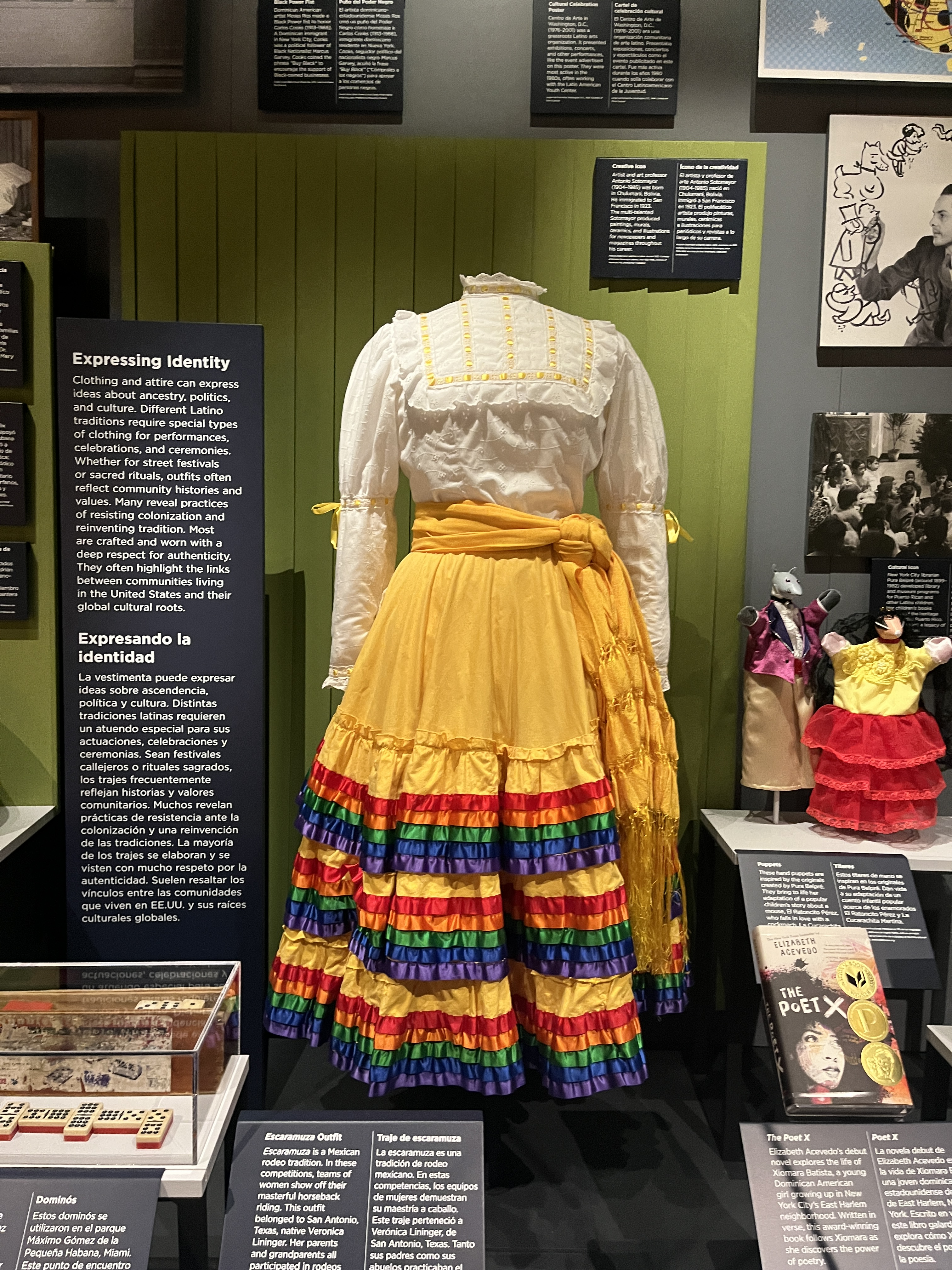 L2-0002204-D1-2023.05.22 Dress with white frilled top and bright yellow skirt with multicolored ribbons.