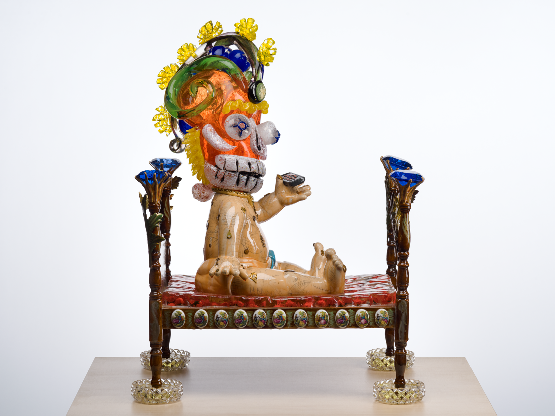 L2-0002261-D1-2023.8.23 ¡2020¡ a sculpture by the de la Torre Brothers, baby with a blown glass skull head on a bed.