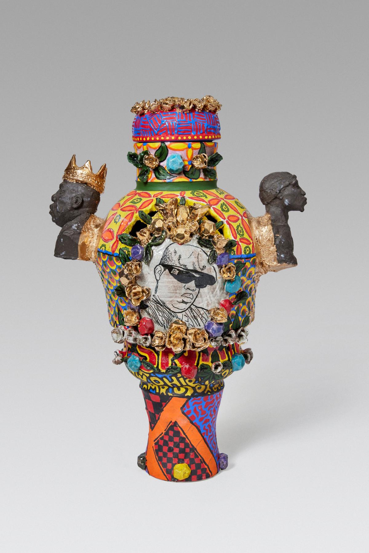 Colorful vase made of glazed stoneware with enamel paint and luster.